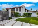 Stunning home with modern gray accents, a red tile roof, and desert landscaping at 4143 Chela Cir, Las Vegas, NV 89120