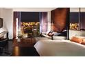 Modern bedroom suite with sleek furniture and a panoramic city view from the large window at 4381 W Flamingo Rd # 1508, Las Vegas, NV 89103