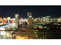 Stunning nighttime view of the illuminated city skyline with The Palms towers in the foreground at 4381 W Flamingo Rd # 1508, Las Vegas, NV 89103