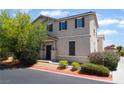 Charming two-story home featuring a well-maintained yard and neutral stucco exterior at 4610 Lime Straight Dr, Las Vegas, NV 89115