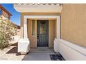 Exterior view of a front door with decorative glass and a tan frame at 576 Foster Springs Rd, Las Vegas, NV 89148