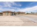 Attractive single-story home with a three-car garage, complemented by a driveway and desert landscaping at 6131 Rio Vista St, Las Vegas, NV 89130