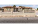 Lovely home with a basketball hoop in the driveway and metal fencing at 6131 Rio Vista St, Las Vegas, NV 89130