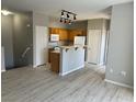 Spacious kitchen featuring an island with breakfast bar, stainless appliances, and ample cabinet space at 6170 E Sahara Ave # 1012, Las Vegas, NV 89142