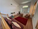 Bright living room features vaulted ceilings, hardwood floors, and abundant natural light at 6351 Davidson Ct, Las Vegas, NV 89110