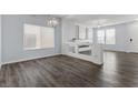 Living room with hardwood floors, neutral walls and lots of natural light at 6540 W Cougar Ave, Las Vegas, NV 89139