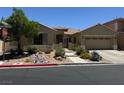 Charming one-story home with desert landscaping, a two-car garage, and a welcoming entrance at 7524 Midnight Rambler St, Las Vegas, NV 89149