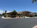 Inviting street view of a well-maintained one-story home with desert landscaping and a two-car garage at 7524 Midnight Rambler St, Las Vegas, NV 89149