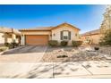 Charming single-story home with a two-car garage and desert landscaping at 766 Topocoba St, Las Vegas, NV 89178
