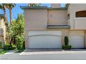 A spacious garage featured with an attached unit, beautiful landscaping and charming features at 8717 Red Brook Dr # 201, Las Vegas, NV 89128