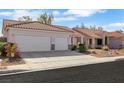 Attractive single-story home with a two-car garage, mature landscaping, and a tile roof at 8849 Pheasant Valley Way, Las Vegas, NV 89123