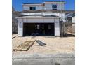 New construction home with a two car garage awaiting finishing touches on a sunny day at 9240 Dekalb Ct, Las Vegas, NV 89148