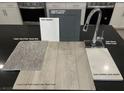 Selection of kitchen finishes includes sleek chrome faucet, quartz countertop and Brellin Grey upgraded cabinets at 9240 Dekalb Ct, Las Vegas, NV 89148