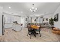 Open-concept living space with a combined kitchen, dining, and living area, featuring modern finishes and wood-look flooring at 965 Nevada State Dr # 41201, Henderson, NV 89002