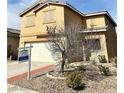 Two-story home featuring a two-car garage and neutral stucco exterior with a For Sale sign at 9844 Ashton Pines Ct, Las Vegas, NV 89147