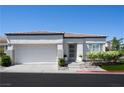 Beautiful single-story home with an attached two-car garage and modern exterior design at 10532 Redwood Ash Ave, Las Vegas, NV 89144