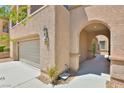 Close up of a two-story home featuring a two-car attached garage and desert landscaping at 11816 Orense Dr, Las Vegas, NV 89138