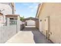 Long driveway with a covered area leading to the detached garage and parking at 1505 Irene Dr, Boulder City, NV 89005