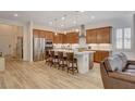 Well-equipped kitchen boasts a central island with seating, modern appliances, and ample cabinetry at 161 Cabo Cruces Dr, Henderson, NV 89011