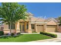 Charming single-story home with a well-manicured lawn, desert landscaping, and a three-car garage at 2150 Ponticello Dr, Henderson, NV 89052