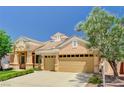 Charming single-story home showcasing desert landscaping and a spacious three-car garage at 2150 Ponticello Dr, Henderson, NV 89052