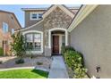 Inviting home entrance with stone accents, manicured landscaping, and stylish front door at 2285 Moresca Ave, Henderson, NV 89052