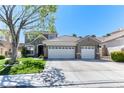 Beautiful home featuring a three-car garage and a well-maintained front yard at 2285 Moresca Ave, Henderson, NV 89052