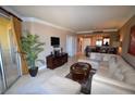 Bright living room showcases open floorplan with a comfortable seating area and sliding doors at 270 E Flamingo Rd # 319, Las Vegas, NV 89169