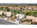 Well-maintained single-story home featuring desert landscaping, a two-car garage, and a tile roof in a suburban setting at 2816 High Range Dr, Las Vegas, NV 89134