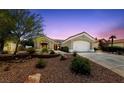 Charming single-story home featuring a well-manicured front yard, neutral paint, and an attached two-car garage at 2816 High Range Dr, Las Vegas, NV 89134
