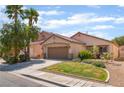 Charming single-story home features a two car garage and well maintained landscaping at 2825 Shayla Bay Ave, North Las Vegas, NV 89086