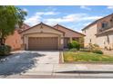 Charming single-story home features a two car garage and well maintained landscaping at 2825 Shayla Bay Ave, North Las Vegas, NV 89086