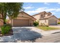 Charming single-story home features a two car garage and well maintained landscaping at 2825 Shayla Bay Ave, North Las Vegas, NV 89086