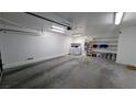 Spacious garage featuring a washer, dryer, and ample shelving for organized storage solutions at 3020 Wilmington Way, Las Vegas, NV 89102