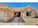 Charming home entrance featuring a brick walkway and manicured landscaping at 3112 Haddon Dr, Las Vegas, NV 89134
