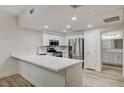 Kitchen features stainless appliances, solid countertops, and bright recessed lighting at 3400 Cabana Dr # 1048, Las Vegas, NV 89122