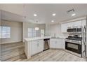Kitchen with breakfast bar, stainless appliances, and bright natural light from windows at 3400 Cabana Dr # 1048, Las Vegas, NV 89122