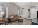Inviting living room with lots of natural light and neutral decor at 4622 English Lavender Ave, North Las Vegas, NV 89031