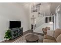 Comfortable living room featuring a staircase, with modern decor at 4622 English Lavender Ave, North Las Vegas, NV 89031
