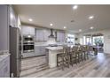 Modern kitchen features sleek gray cabinets, granite countertops, and stainless steel appliances at 5328 Hickory Tree St, Las Vegas, NV 89149