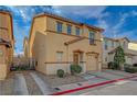 Attractive two-story home featuring a terracotta roof and attached one-car garage at 687 Porchtown Ave, Las Vegas, NV 89183