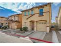 Charming two-story home with a terracotta roof, attached garage, and neat front yard at 687 Porchtown Ave, Las Vegas, NV 89183