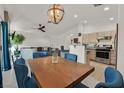 Open-concept floor plan with dining area, kitchen, and living room at 701 Wheat Ridge Ln # 203, Las Vegas, NV 89145