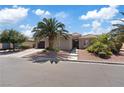 Charming single-story home featuring desert landscaping, a tile roof, and a private gated entrance at 7289 Sea Anchor Ct, Las Vegas, NV 89131