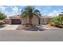 Charming single-story home with desert landscaping, a tile roof, and a two-car garage at 7289 Sea Anchor Ct, Las Vegas, NV 89131