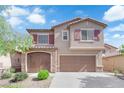 Charming two-story home featuring a finished two car garage, desert landscaping and a welcoming facade at 7300 Lavender Rose Ave, Las Vegas, NV 89117