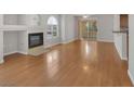 Inviting living room with cozy fireplace and sliding glass doors at 7950 W Flamingo Rd # 1077, Las Vegas, NV 89147
