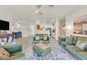 Bright living room with modern decor, stylish furniture, and seamless flow to the kitchen and dining area at 8737 Red Brook Dr # 201, Las Vegas, NV 89128