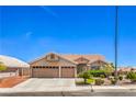Beautiful single-story home with a three-car garage and well-maintained landscaping at 1044 Spanish Needle St, Henderson, NV 89002