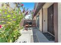 Inviting outdoor patio space with chairs, pavers, and floral accents at 110 Huckleberry Ln, Henderson, NV 89074